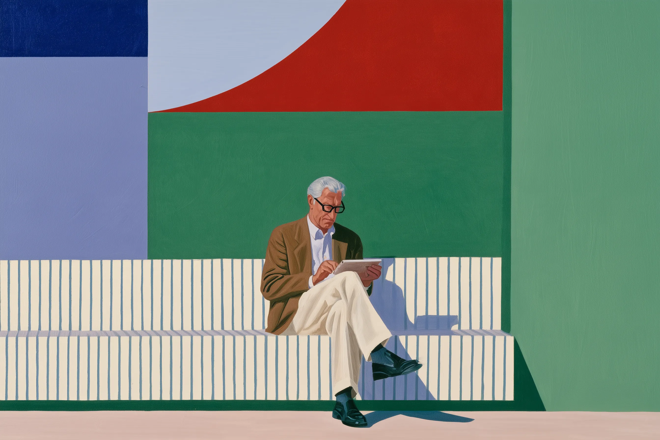 A man reading on a tablet, seated on a striped bench in front of a painted wall of blue, red and green